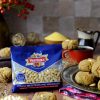 pinoli mediterranei ventura in busta e piatto con polpette e bacche rosse in vaso